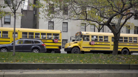 yellow school bus - parked buses waiting for students on Park Ave autumn Manhattan New York City