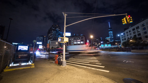 Freedom Tower at night with crossing light and Canal Street subway station entrance - 4K timelapse in Downtown Manhattan NYC