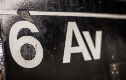 6th Ave sign close up