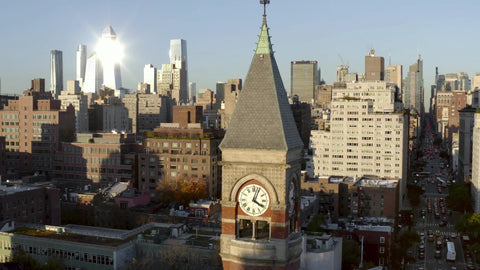 aerial pulling back from Jerfferson Market Library clock tower Manhattan New York City NYC