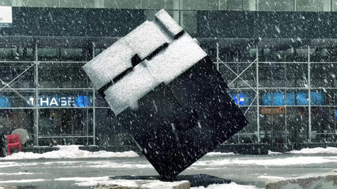 Astor Place cube sculpture in Cooper Square in snow storm snowing in winter blizzard in New York City NYC 1080