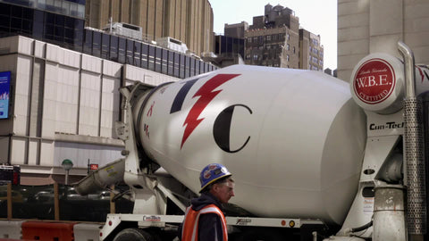 cement truck spinning turning driving construction worker New York City NYC
