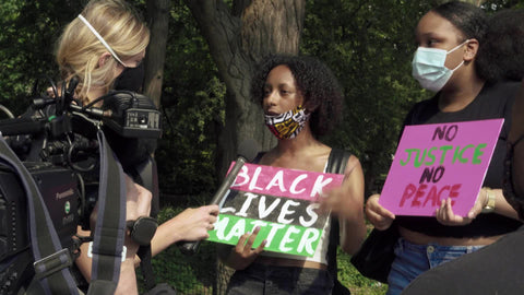 White reporter interviewing Black women at BLM rally in New York City