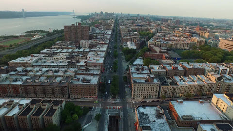 aerial view backing up from buildings in Harlem Uptown in NYC