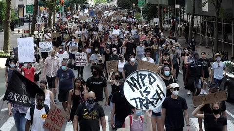 people in Black Lives Matter march - marching in street with signs on 5th Ave New York City 1080