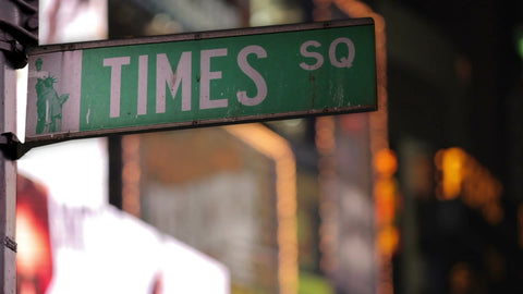 Times Square sign at night in Manhattan NYC