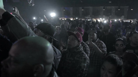 crowd watching hip hop show in slow motion