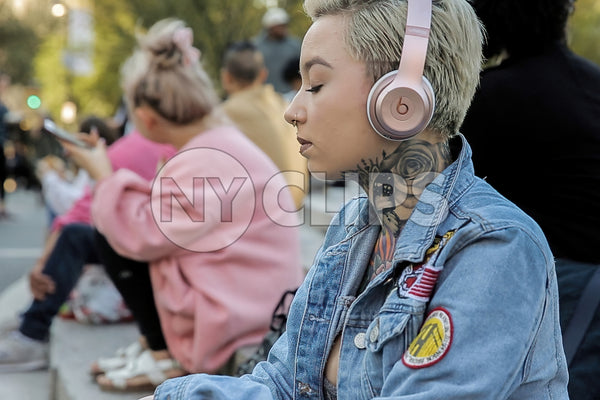 Girl with Tattoos on Headphones