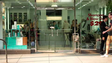 beauty salon storefront on 8th street on summer day in Manhattan