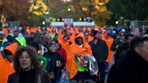 men in orange ponchos after Marathon in Central Park - crowd of people walking 1080 HD in NYC