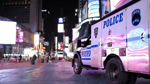 NYPD police truck parked in empty Times Square late at night in NYC