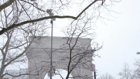snowing on Washington Square Park arch in winter blizzard - snow in Manhattan New York City, NYC 4K and 1080 HD