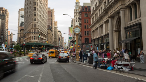 day turning into night on 5th Avenue with famous clock lighting up - timelapse in Manhattan in 4K and 1080 HD in NYC