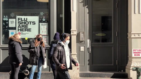people walking with masks Broadway Downtown Manhattan New York City NYC