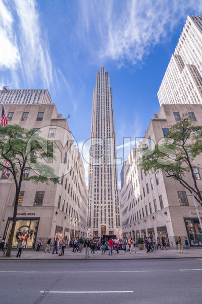 Rockefeller Center on sunny day with blue sky and clouds in Midtown Manhattan