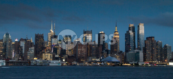 Manhattan skyline in early evening on beautiful night with Empire State Building lights