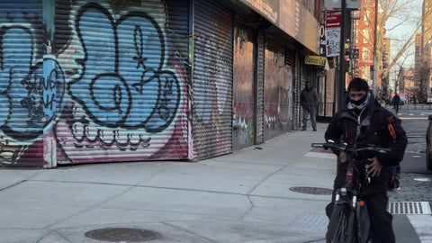 graffiti on wall of gritty Lower East Side street corner covid winter pandemic Downtown New York City NYC