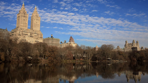 San Remo Building hotel over Central Park pond - 4K timelapse during day in Manhattan