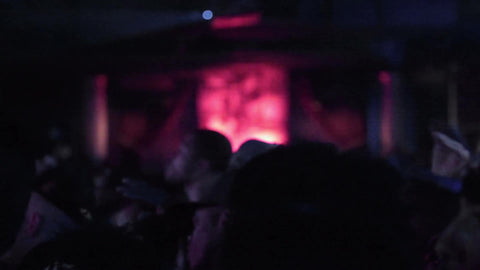 dark concert room - people watching hip hop show - rap music fans in crowd