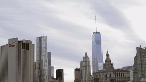 Lower Manhattan view from Brooklyn Bridge - Freedom Tower on cloudy day