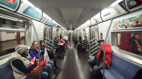 interior subway train with passengers sitting - moving through MTA carriage with steadicam in 1080 HD NYC