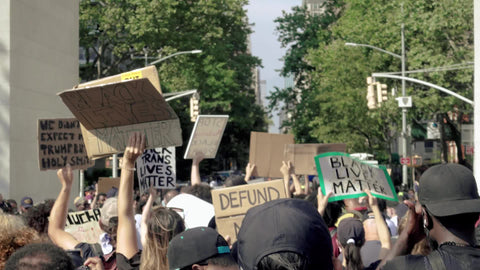 signs at BLM rally in Washington Square Park in NYC