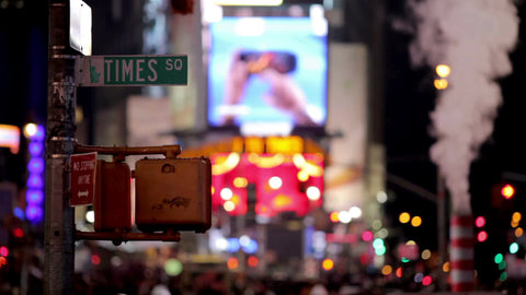 Times Square sign at night with colorful flashing lights in Manhattan New York City NYC