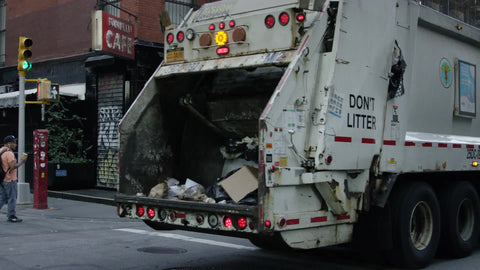 garbage truck driving in SoHo in slow motion in NYC