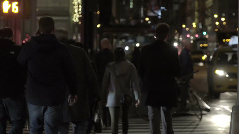 people crossing street late at night in Midtown Manhattan in slow motion