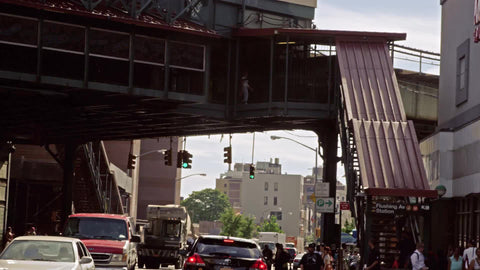 driving under elevated subway station in Brooklyn - slow motion