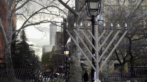 huge Menorah in Washington Square Park on winter day - zooming out with Freedom Tower in background