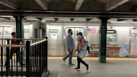woman threatens Asian person with punch body check hate on subway platform NYC