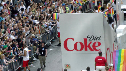 Gay Pride March in Manhattan - huge crowd of people waving rainbow flags in support of LGBT in 4K and 1080 HD in NYC