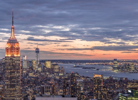 famous landmarks - Empire State Building and Freedom Tower in breathtaking Manhattan cityscape from high view at sunset in early evening NYC
