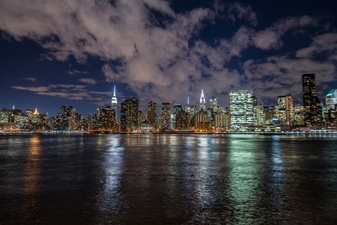 Manhattan skyline at night with East River