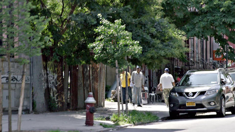 driving past street in Bedstuy Brooklyn - African-American men outside on Bedford Stuyvesant block