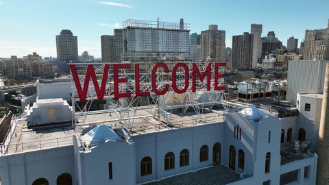 pulling out from welcome sign in Brooklyn New York City