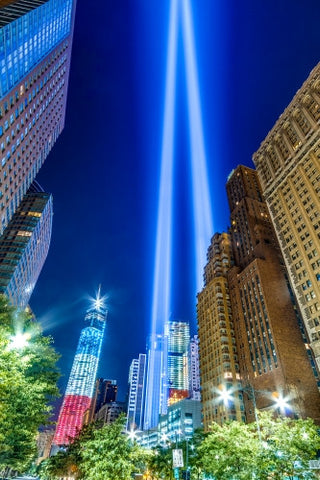 911 beams and Freedom Tower with red white and blue American flag colors at night - beautiful HDR