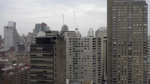 buildings and skyscrapers on east side of Manhattan from moving tram in 1080 HD in NYC