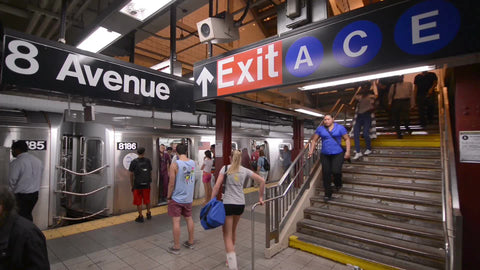 crowded subway platform and stairs with people exiting train - commuting on 8th ave in 1080 HD NYC