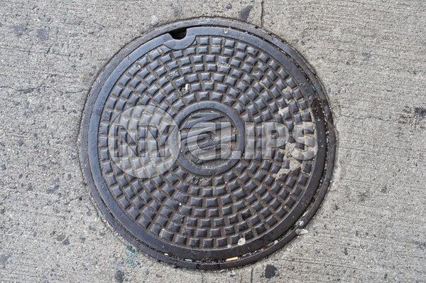NYC manhole - sewer cover on street
