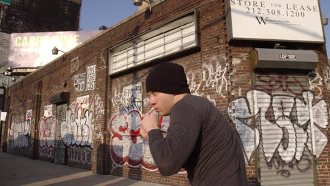 man boxing in front of graffiti building - sparring exercising outside on west side of Manhattan in 1080 HD and 4K NYC