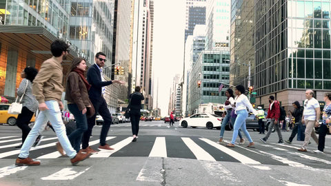 busy Midtown crosswalk people crossing street Bryant Park Manhattan NYC