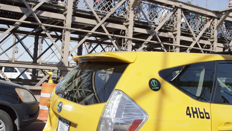 driving across Brooklyn Bridge - caravan taxi cab crossing alongside driver's side pov in 4K NYC