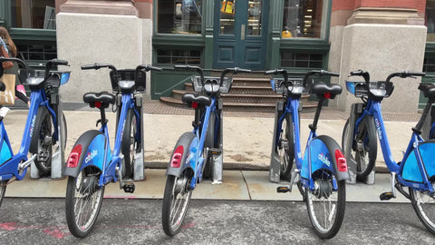 Citibike blue bicycles parked at docking station in Manhattan New York City NYC