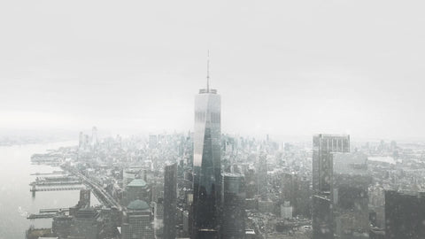 Freedom Tower snowing in Manhattan aerial New York City NYC