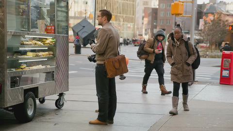 people walking past food truck in morning Cooper Square NYC