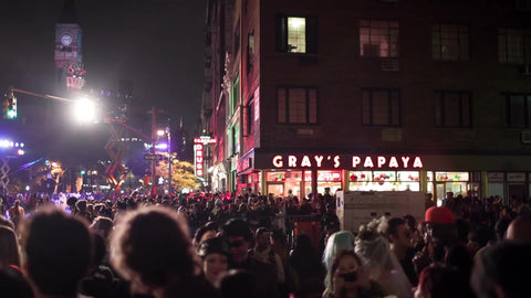 crowd at Halloween parade - Gray's Papaya on 8th st and 6th Ave in Greenwich Village