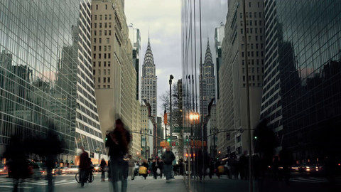 Chrysler Building on busy crowded Midtown Manhattan street - 4K timelapse of 42nd st from day to night