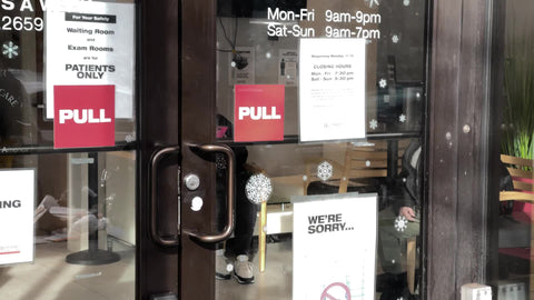 man with mask entering City MD medical clinic testing site for Covid screening